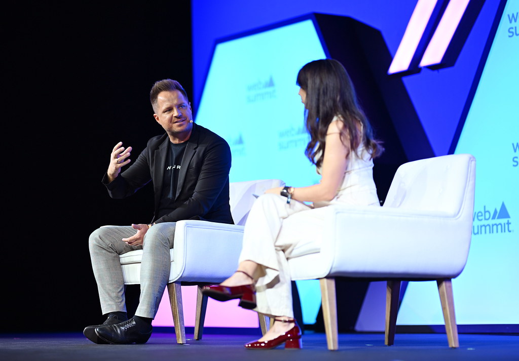 David Reger and Pascale Davies seated on the Web Summit stage in November 2024.